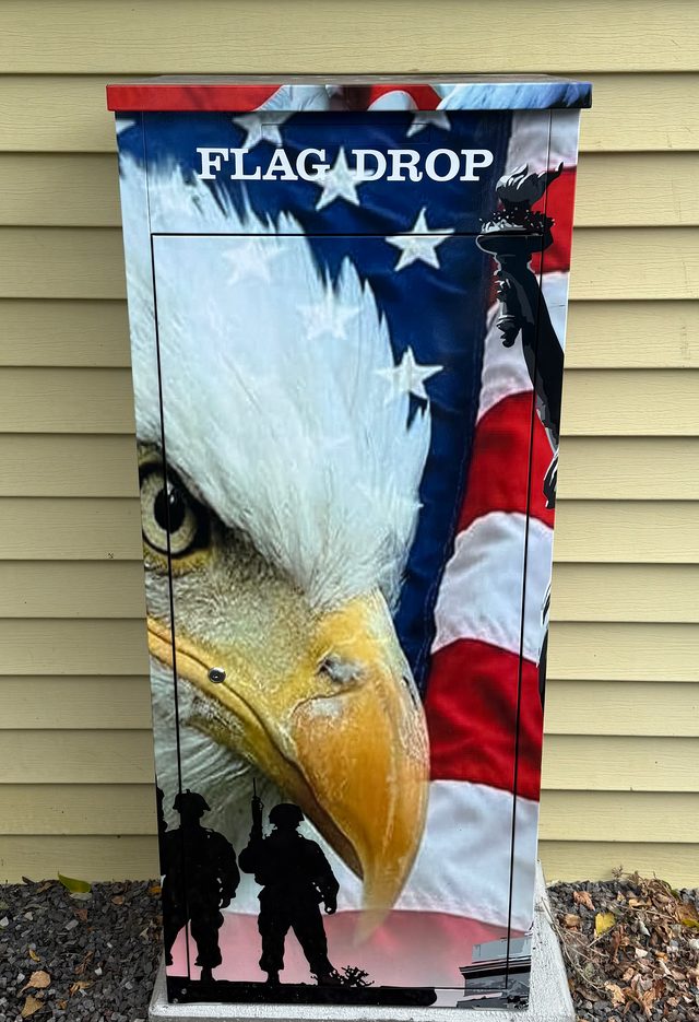 The Flag Drop box outside VFW Post 7765, wrapped in a bald eagle, the American flag and soldier silhouettes